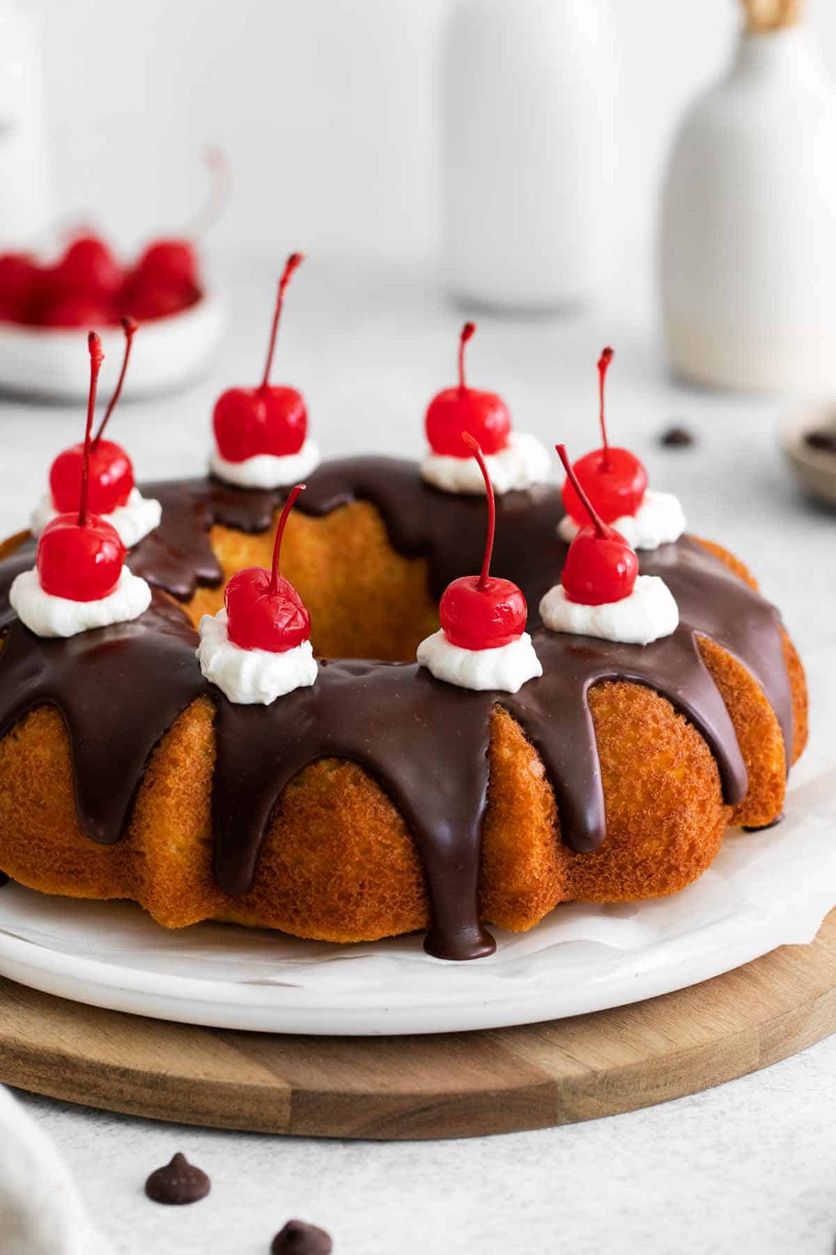 Boston Cream Poke Cake with Chocolate Ganache and Cherries