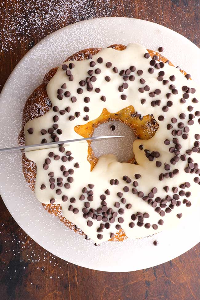 Cannoli Bundt Cake topped with mini chocolate chips