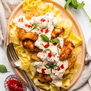 Crusted Chicken with Basil-Pimento Creamy Sauce over Noodles