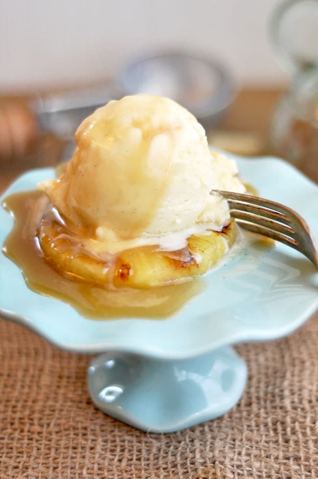 Grilled Pineapple with vanilla ice cream rum sauce