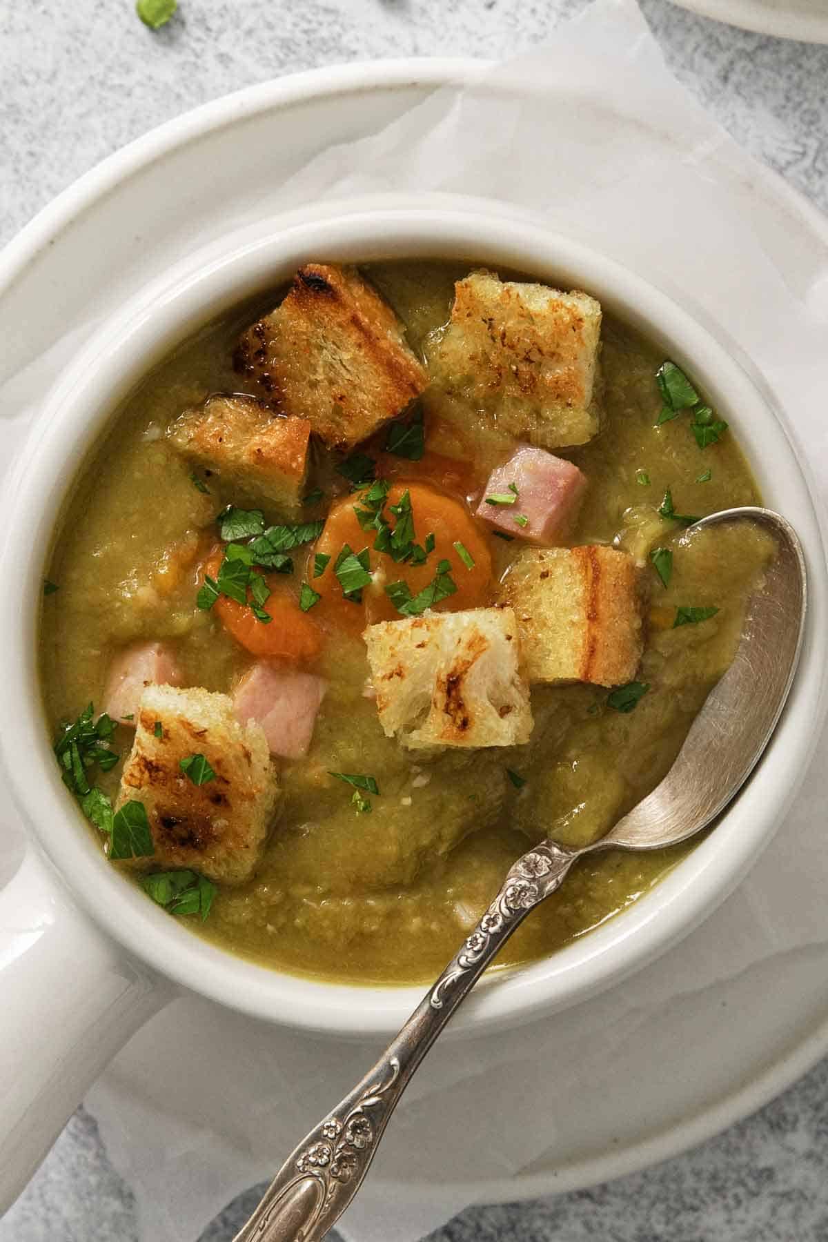 Creamy Split Pea Soup with Ham, topped with croutons