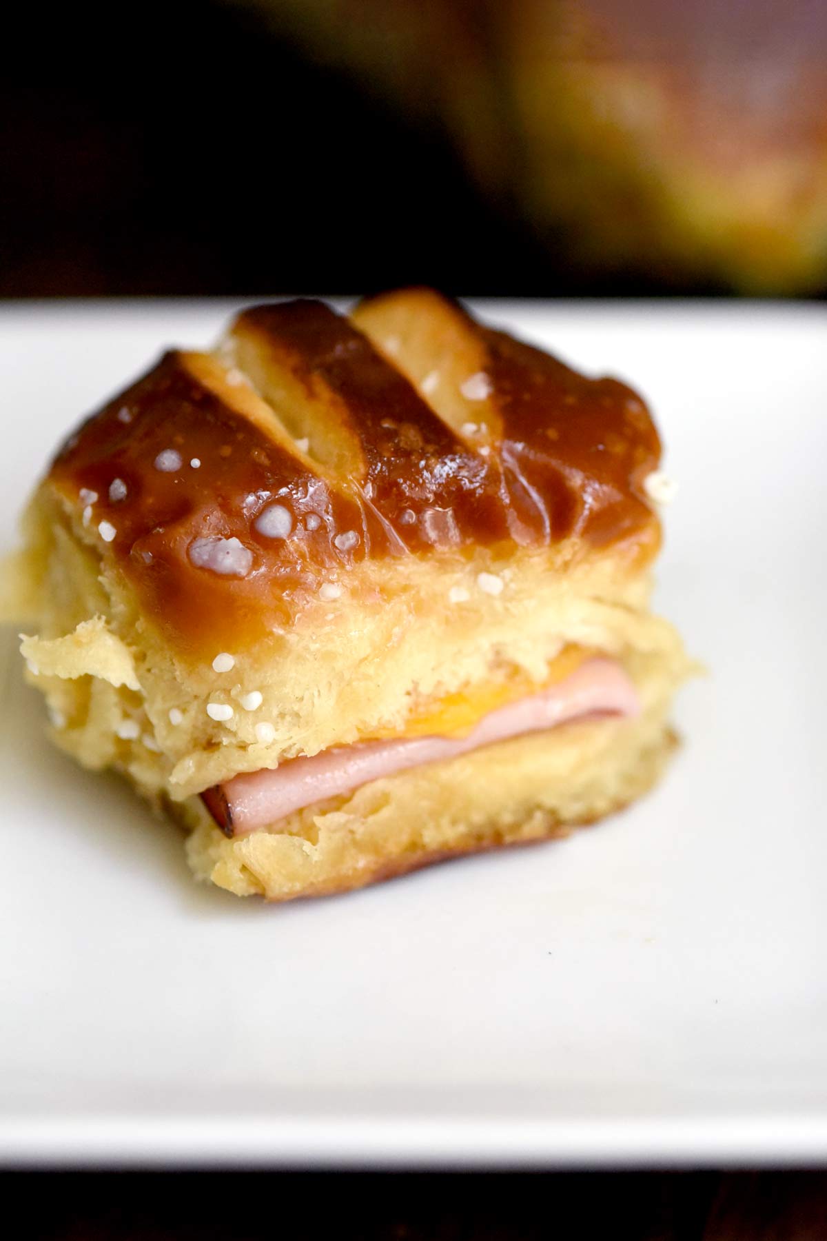 Ham and Cheese Pretzel Hawaiian Roll Slider on a Plate