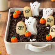 Halloween Oreo Dirt Cake with Milano Cookie Graves, Candy Pumpkins and Ghost Peeps