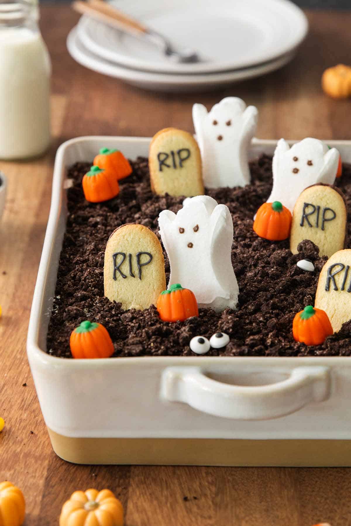 Halloween Oreo Dirt Cake with Milano Cookie Graves, Candy Pumpkins and Ghost Peeps