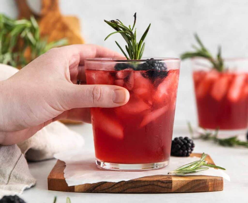 Blackberry Whiskey Sour with Smoked Rosemary Garnish