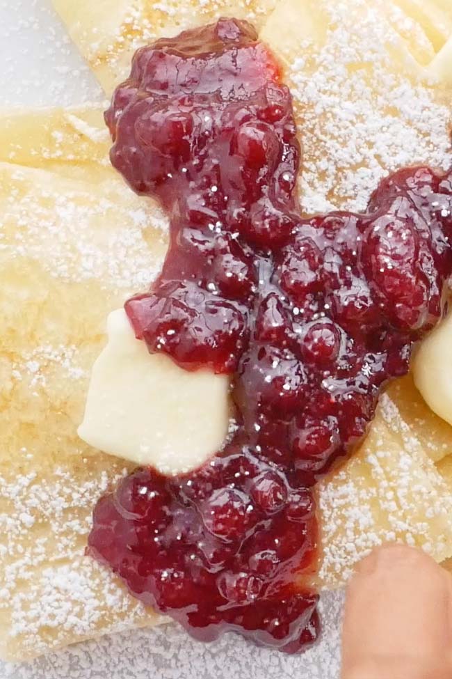 Swedish Crepes with Lingonberry Jam. Butter and Powdered Sugar